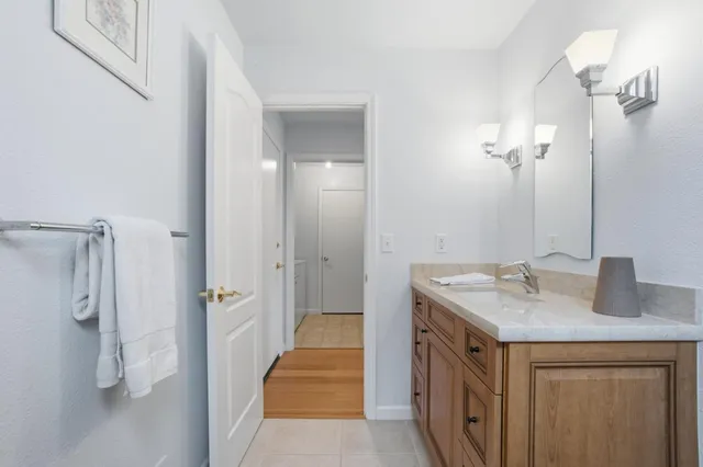 a view of a hallway with living room and furniture