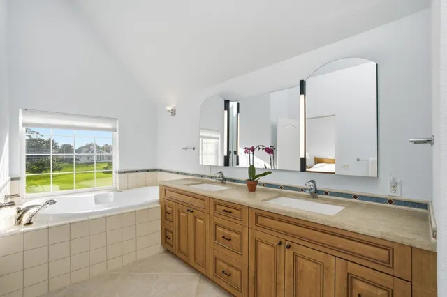 a bedroom with a bed and chair