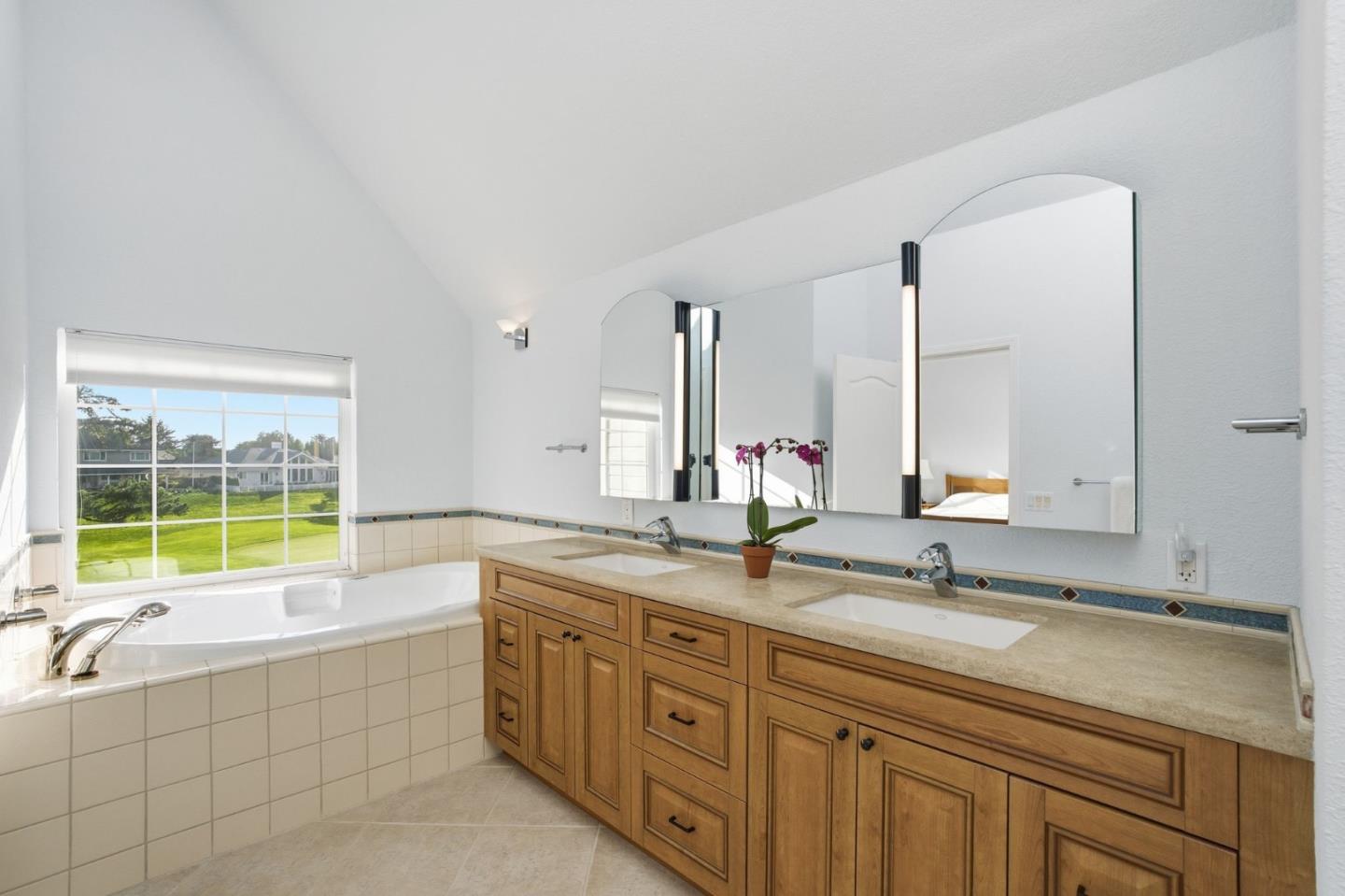 25 Merion Road Half Moon Bay, CA 94019 - Photo 36 of 72 a bathroom with a granite countertop sink and a bathtub