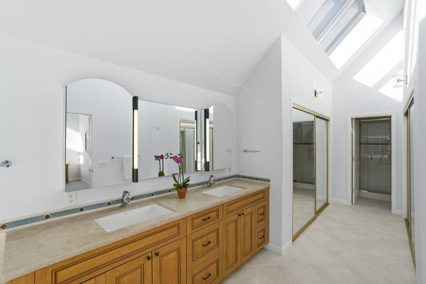25 Merion Road Half Moon Bay, CA 94019 - Photo 41 of 72 a bathroom with double vanity sinks and a large mirror