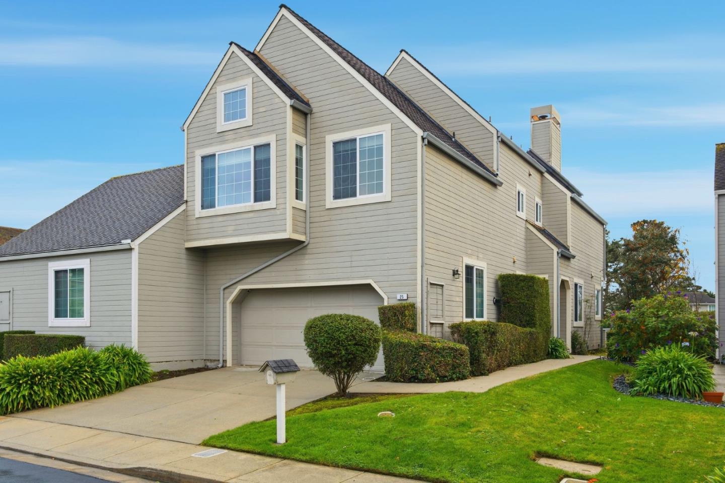 25 Merion Road Half Moon Bay, CA 94019 - Photo 5 of 72 a front view of a house with a yard and garage