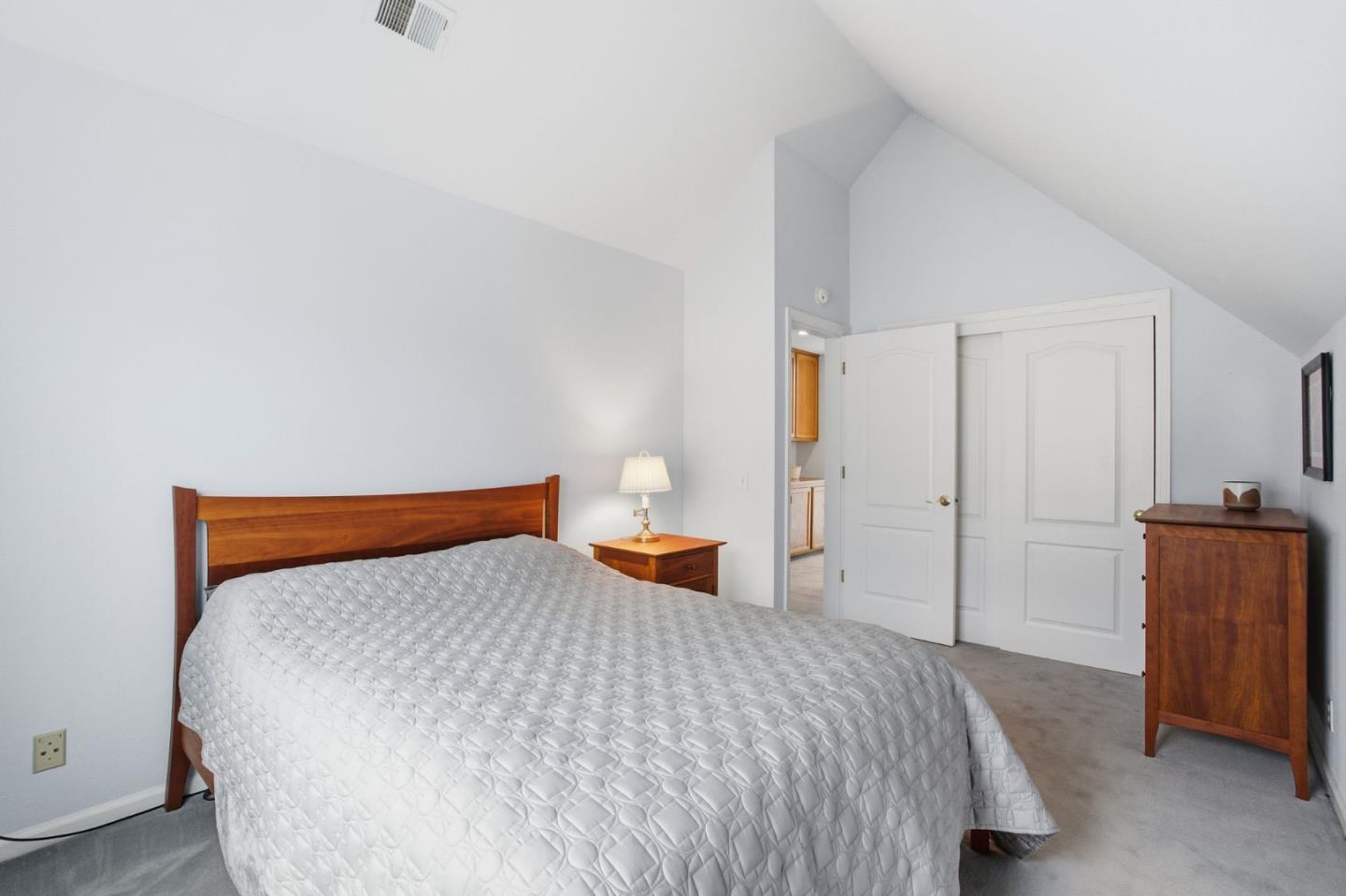 25 Merion Road Half Moon Bay, CA 94019 - Photo 52 of 72 a bedroom with a bed and chair