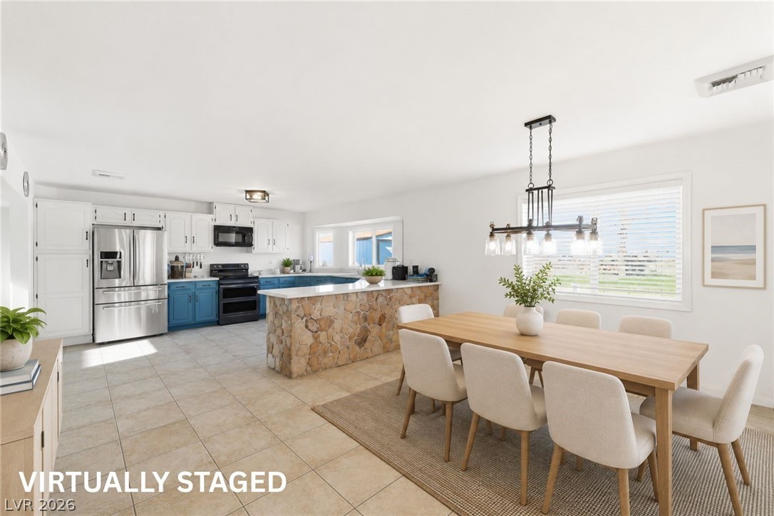 2570 East Kellogg Road Pahrump, NV 89048 - Photo 14 of 60 Virtually Staged large, open dining room with exit to outdoors