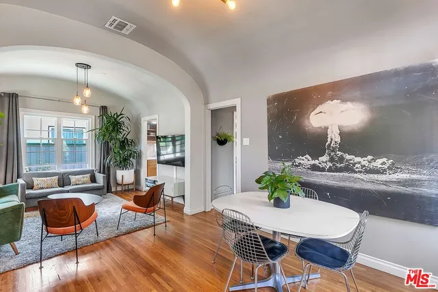 a living room with furniture and a table