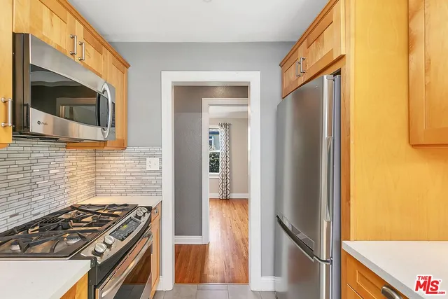 a kitchen with a stove and a microwave