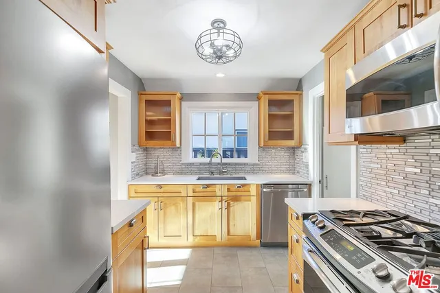a kitchen with a stove and a sink