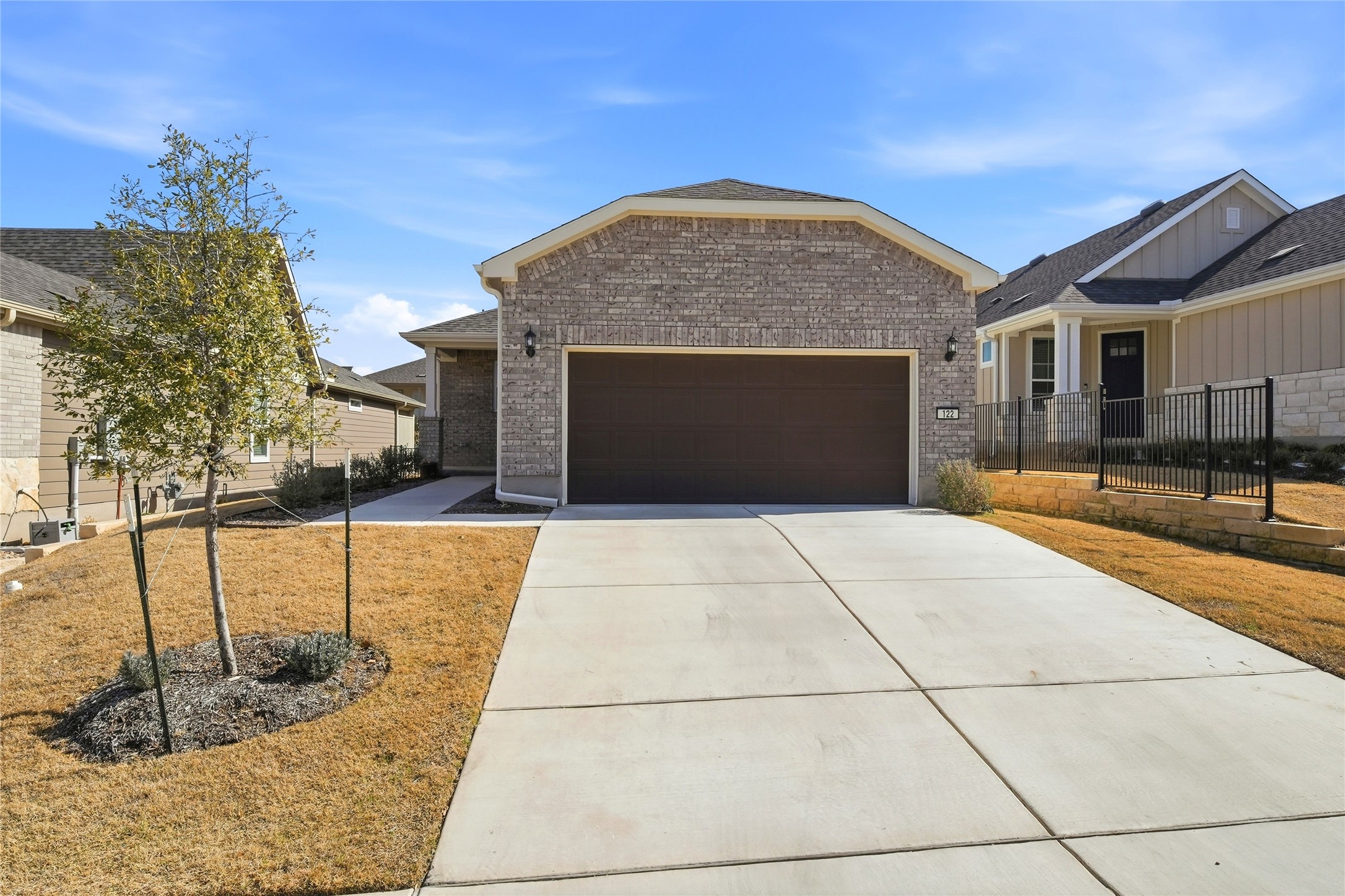 122 Clay Hl Street Georgetown, TX 78633 - Photo 1 of 31 Craftsman inspired home featuring a garage, brick siding, and driveway