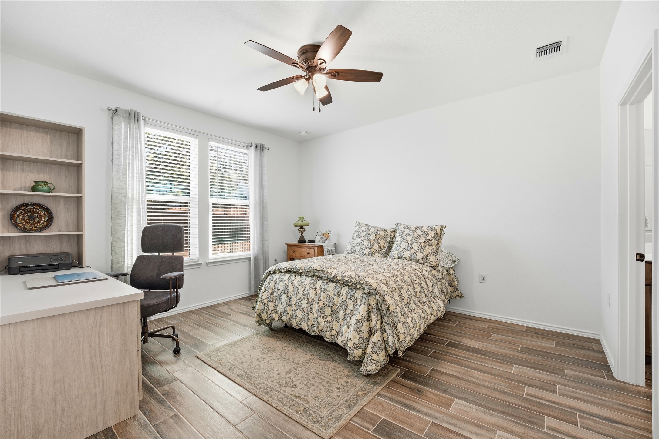 122 Clay Hl Street Georgetown, TX 78633 - Photo 14 of 31 Bedroom featuring a desk, wood tiled floors, and ceiling fan