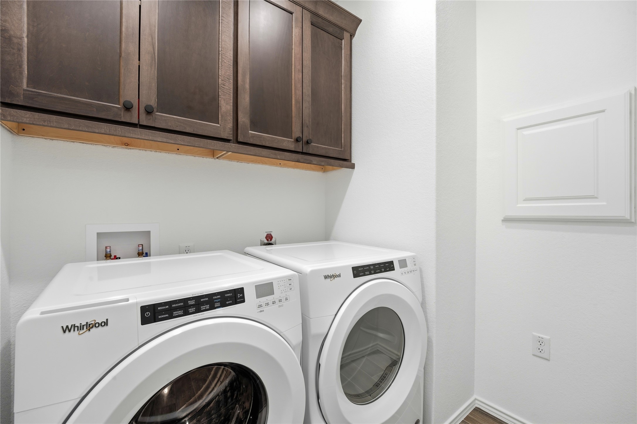 122 Clay Hl Street Georgetown, TX 78633 - Photo 20 of 31 Laundry room with cabinet space and washer and clothes dryer