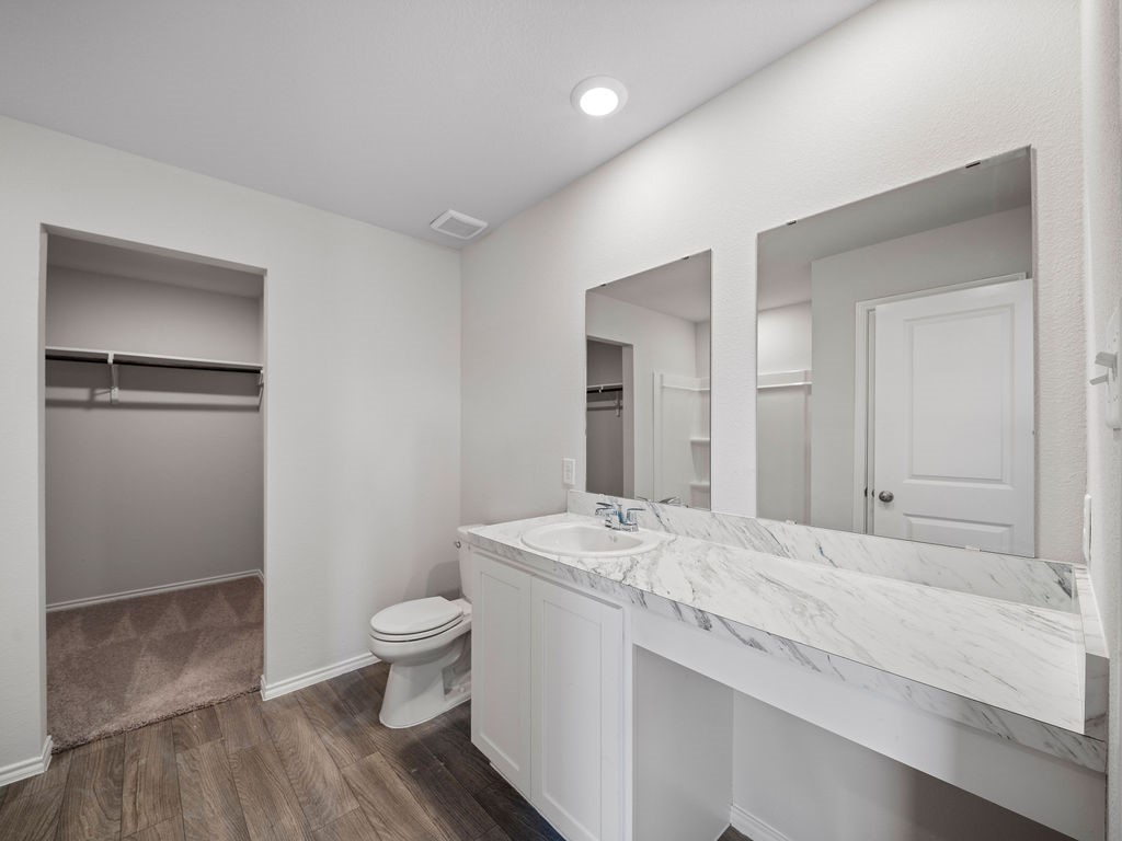 218 Stoney Ridge Lufkin, TX 75904 - Photo 16 of 29 a spacious bathroom with a granite countertop sink a toilet and shower