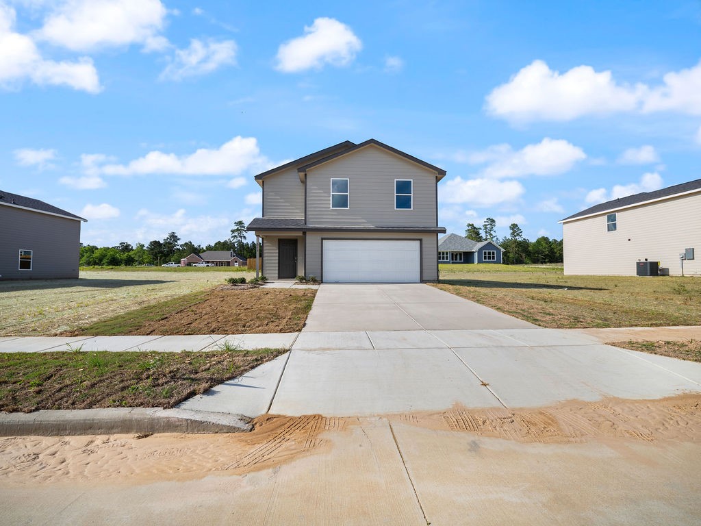 218 Stoney Ridge Lufkin, TX 75904 - Photo 2 of 29 a front view of a house with a yard