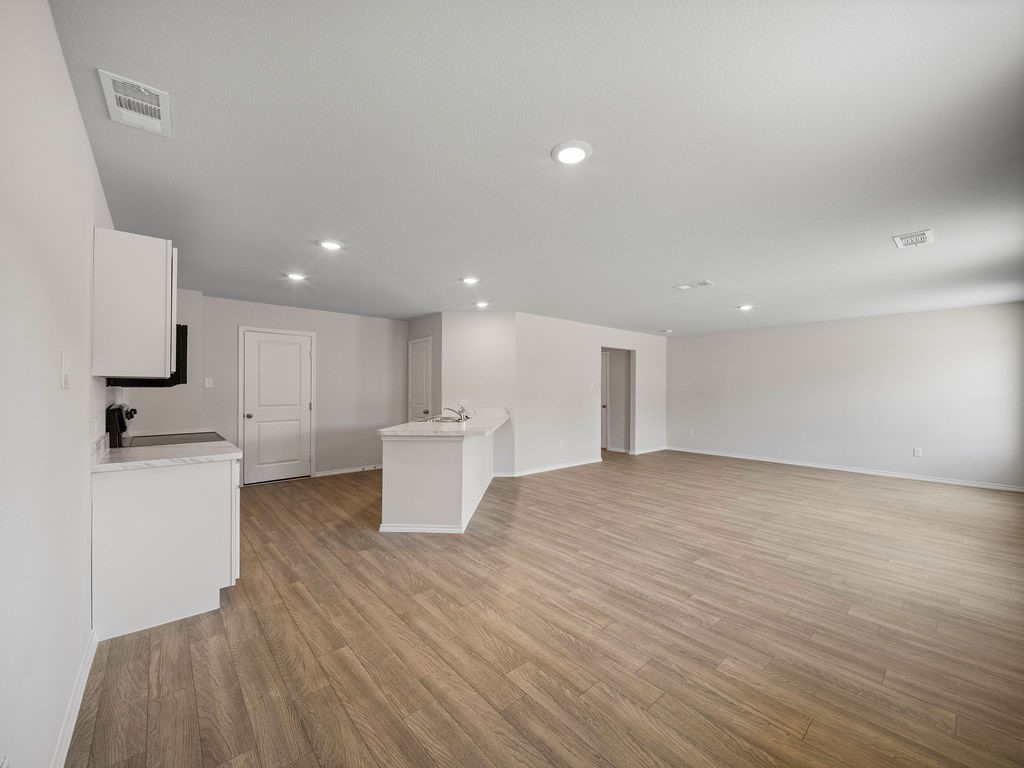 218 Stoney Ridge Lufkin, TX 75904 - Photo 7 of 29 a view of a kitchen with a sink and a refrigerator