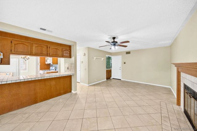 a living room with fireplace furniture and a flat screen tv