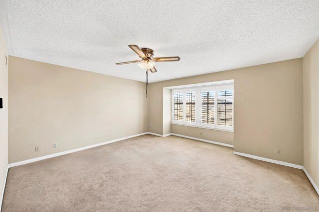 a bed room with a bed and a potted plant