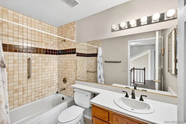 a view of a house with backyard porch and sitting area