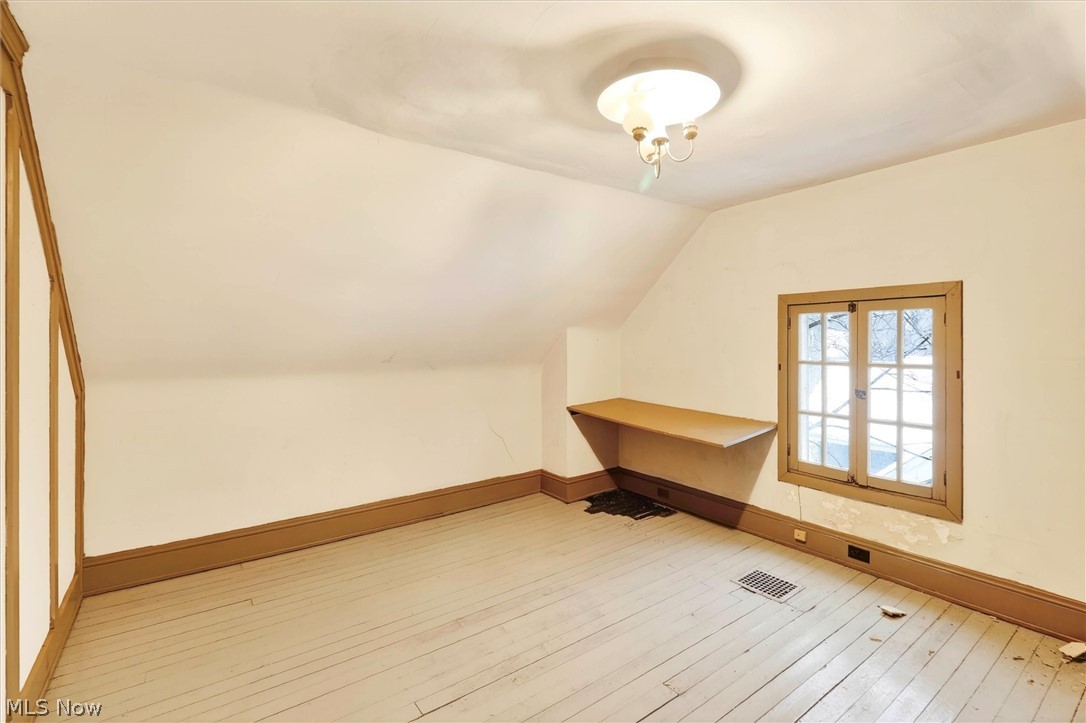 1798 Middlehurst Road Cleveland, OH 44118 - Photo 38 of 49 Additional living space with lofted ceiling and light wood-style floors