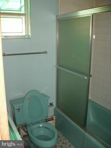 9612 Livingston Road Fort Washington, MD 20744 - Photo 5 of 13 a bathroom with a sink a toilet and a mirror