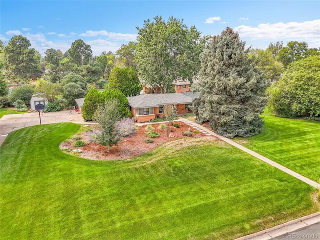 a view of a swimming pool with a yard