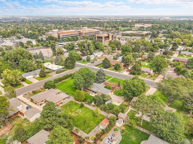 an aerial view of residential houses with outdoor space