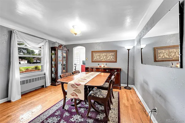 a dining room with a table and chairs