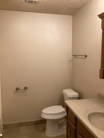 a bathroom with a sink and toilet