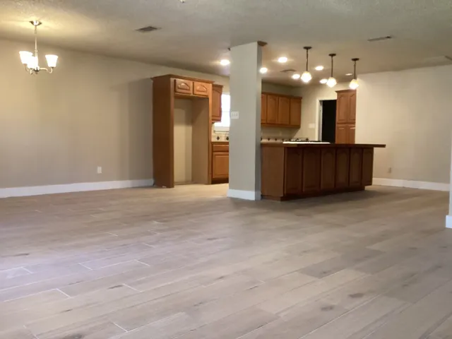 a view of kitchen and kitchen with a sink