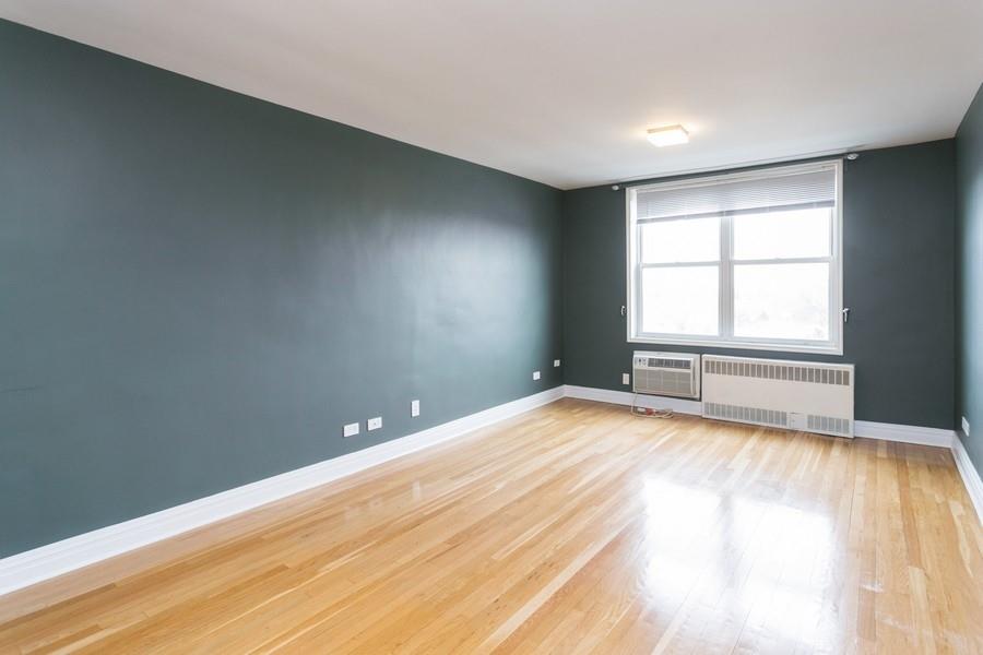 8301 Ridge Boulevard, Unit 6D Brooklyn, NY 11209 - Photo 9 of 23 wooden floor in an empty room with a window
