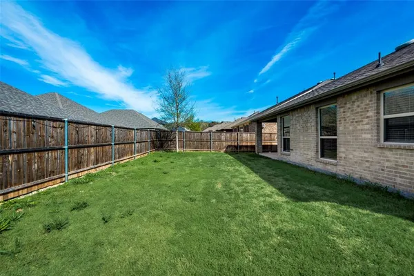a view of backyard with green space