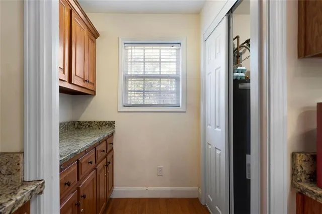 a view of an entryway with wooden floor