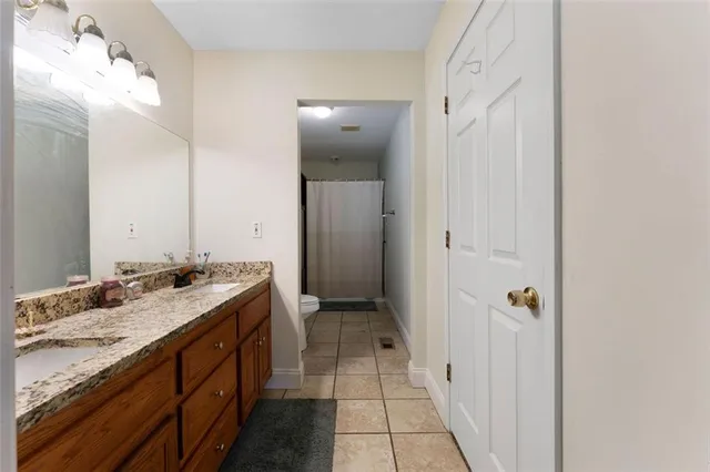 a bathroom with a sink a mirror and a shower