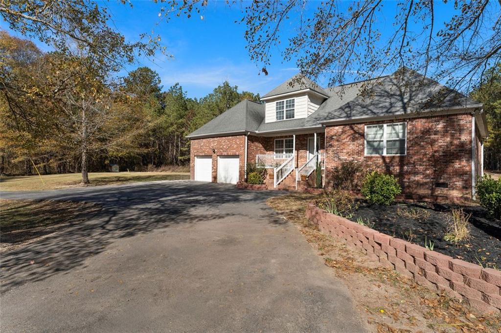 577 Everett Springs Road Southwest Calhoun, GA 30701 - Photo 27 of 34 a view of a house with a yard and pathway