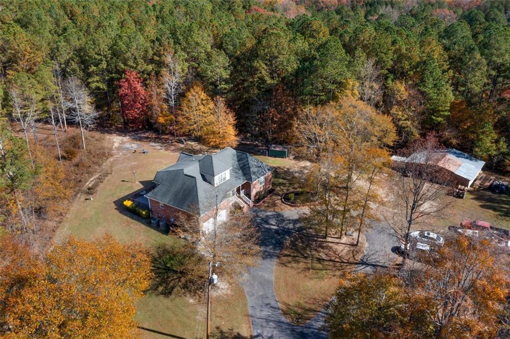 577 Everett Springs Road Southwest Calhoun, GA 30701 - Photo 28 of 34 an aerial view of residential house with outdoor space