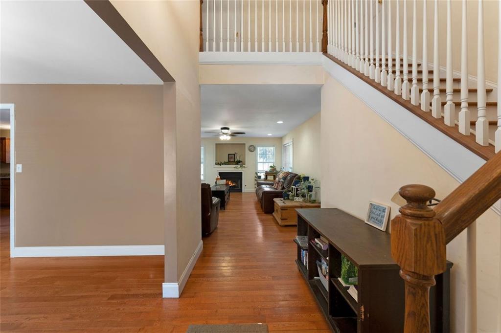 577 Everett Springs Road Southwest Calhoun, GA 30701 - Photo 3 of 34 a view of a hallway with wooden floor