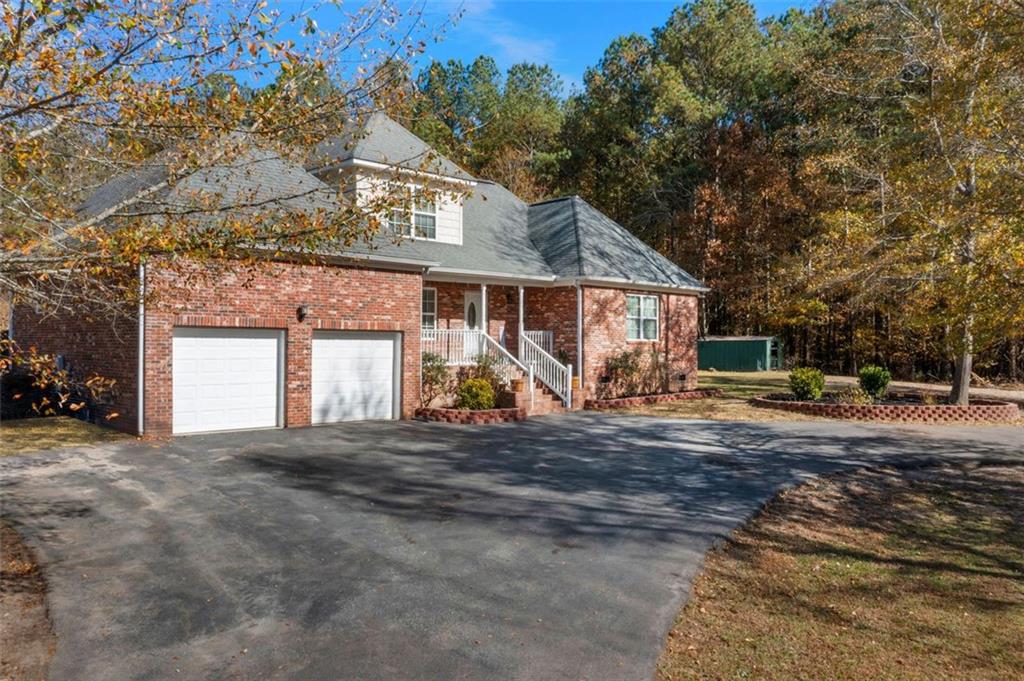 577 Everett Springs Road Southwest Calhoun, GA 30701 - Photo 33 of 34 a view of a house with a outdoor space