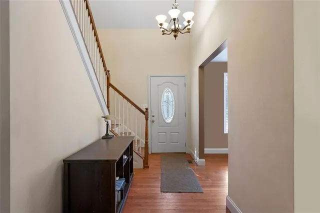 a view of an entryway with wooden floor