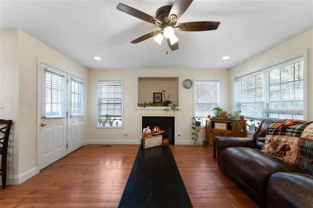 a living room with furniture and a fireplace