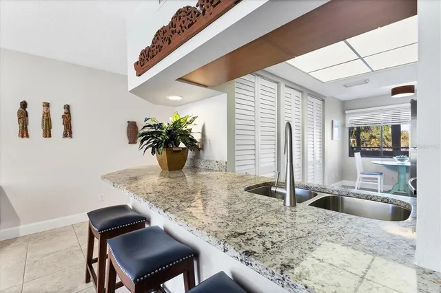 a kitchen with stainless steel appliances granite countertop a stove and a sink