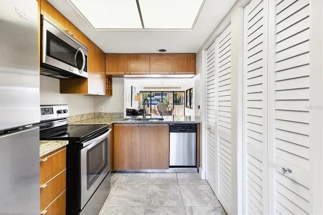 a view of a dining room with furniture and window