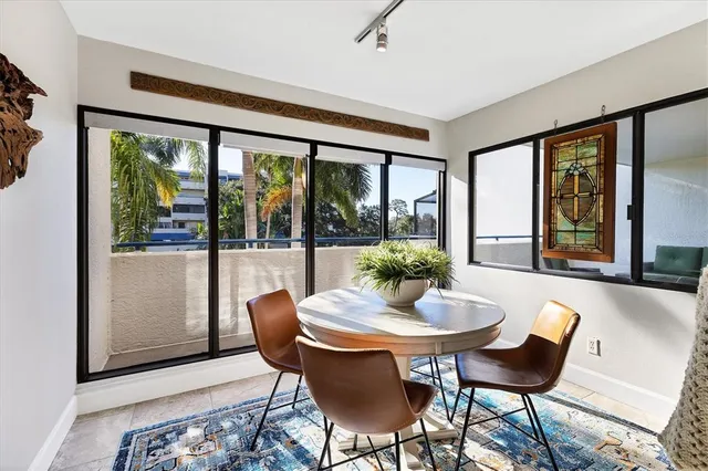 a bedroom with a bed a flat screen tv and dresser