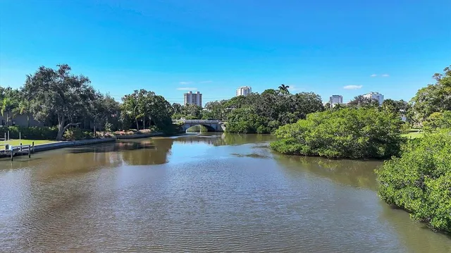 an aerial view of residential houses with outdoor space and swimming pool