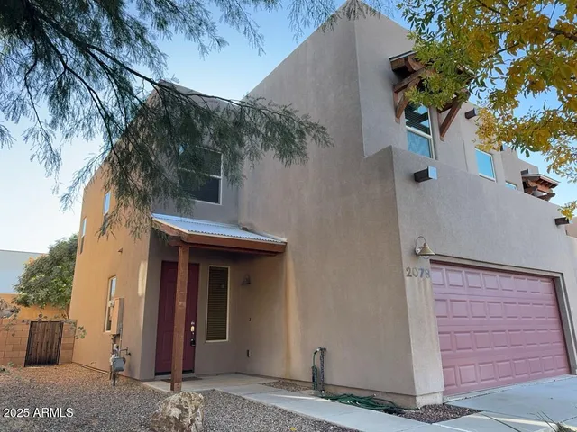 a view of a house with a tree