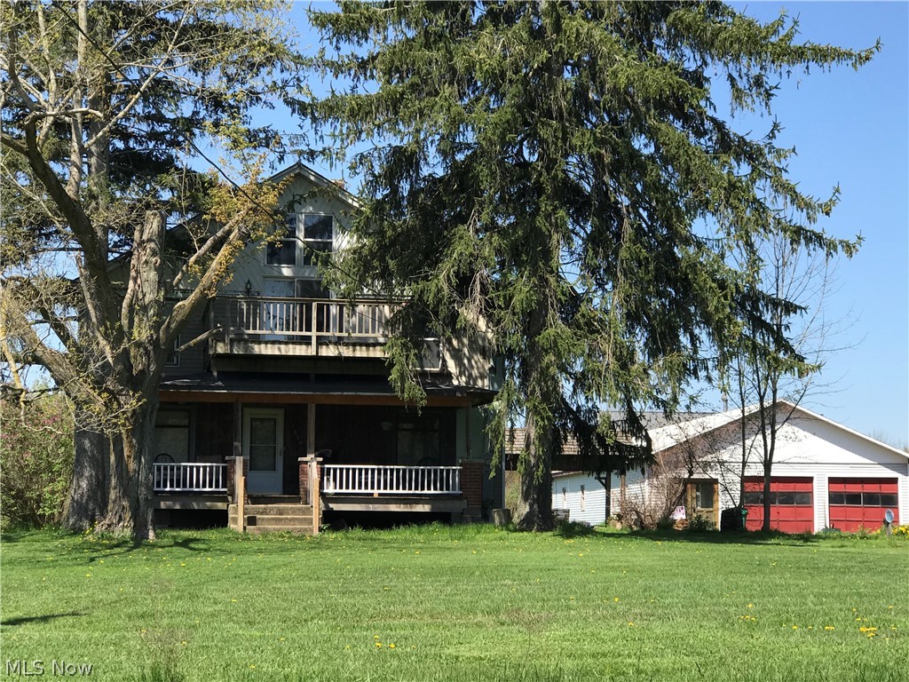 11850 Hunt Road Huntsburg, OH 44046 - Photo 20 of 26 Front view with porch and second level deck.
