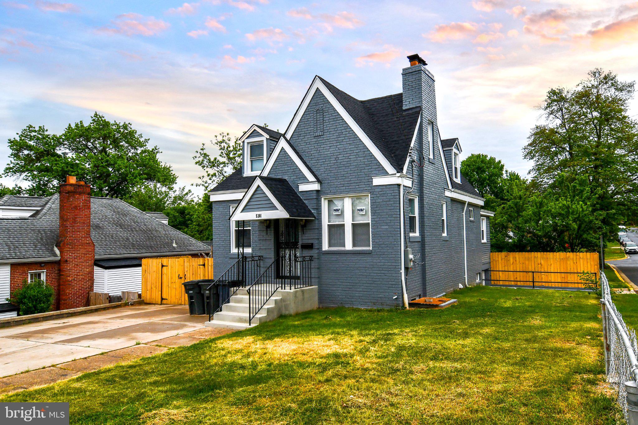 Charming gray home with spacious yard.