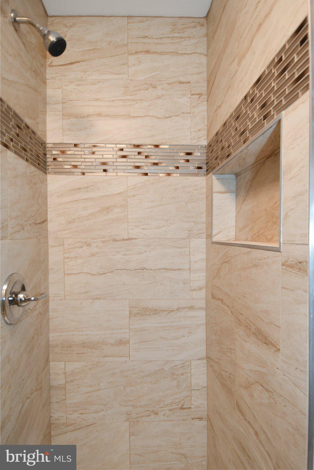 5301 Tilden Road Bladensburg, MD 20710 - Photo 22 of 45 Elegant tiled shower with modern accents.