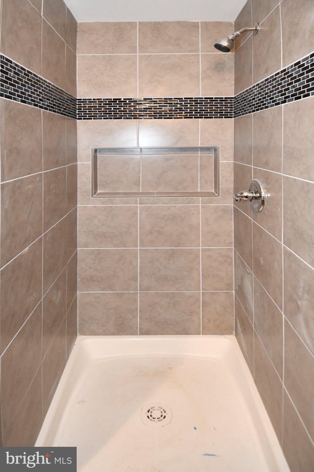 5301 Tilden Road Bladensburg, MD 20710 - Photo 30 of 45 Sleek, modern shower with elegant tiles.
