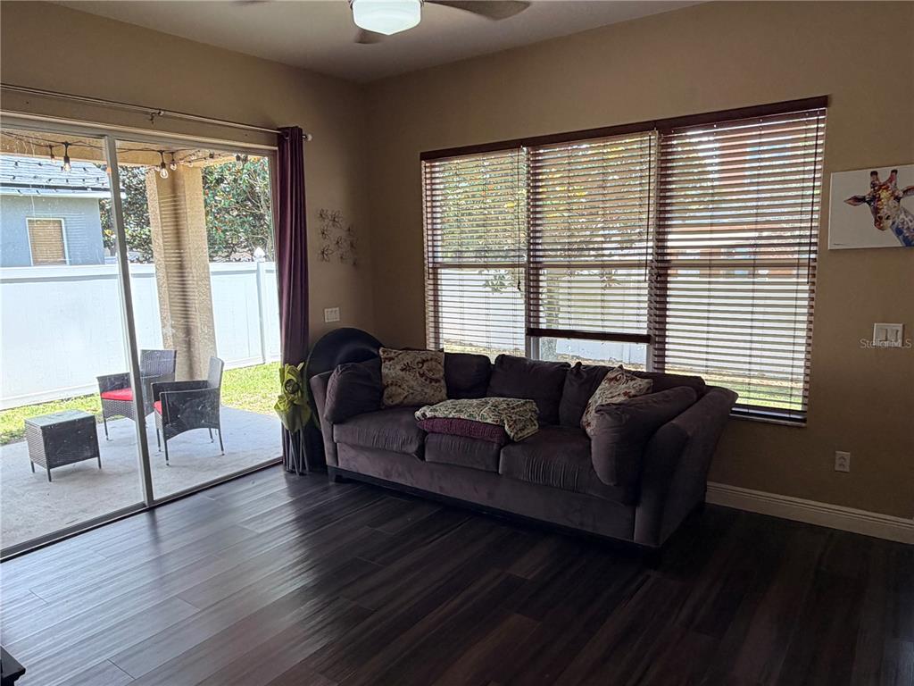 13250 Mandalay Place Spring Hill, FL 34609 - Photo 7 of 28 a living room with furniture and a large window