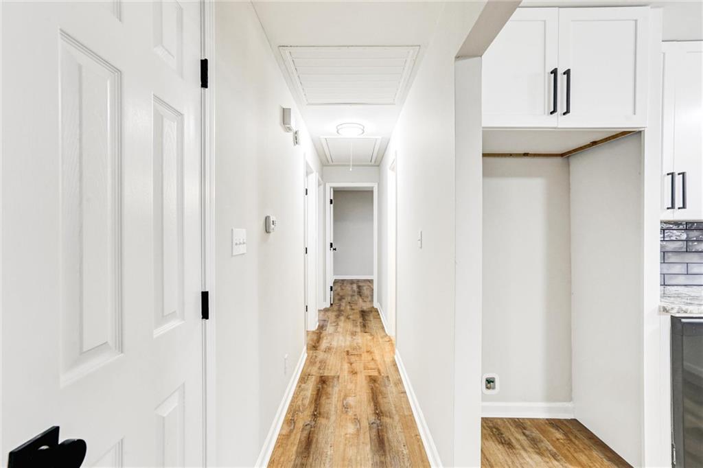 122 Capitol Avenue Winder, GA 30680 - Photo 13 of 34 a view of a hallway with white walls