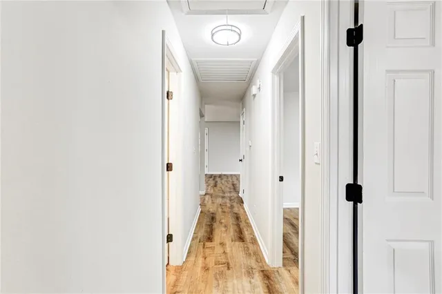 a view of a hallway with a door