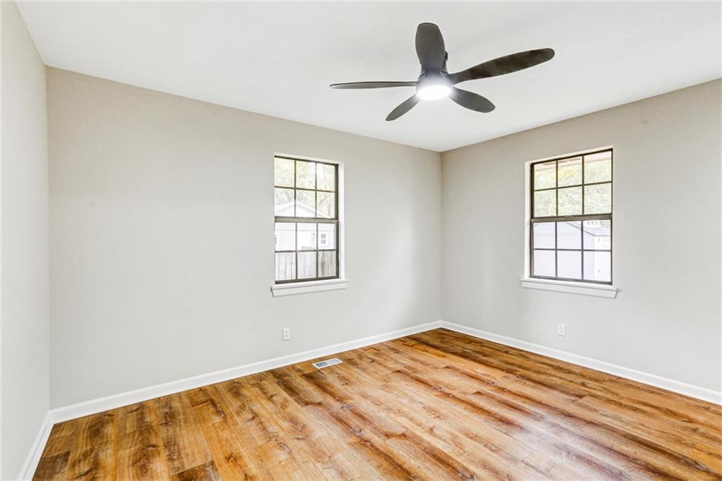 122 Capitol Avenue Winder, GA 30680 - Photo 17 of 34 a view of a livingroom with a ceiling fan and window