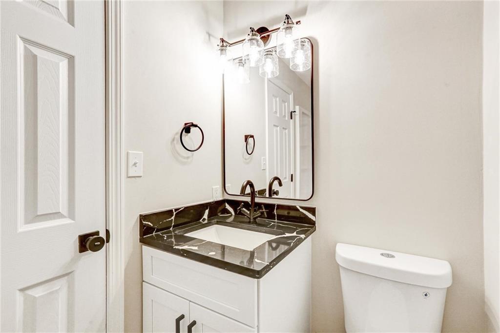 122 Capitol Avenue Winder, GA 30680 - Photo 26 of 34 a bathroom with a sink and a toilet